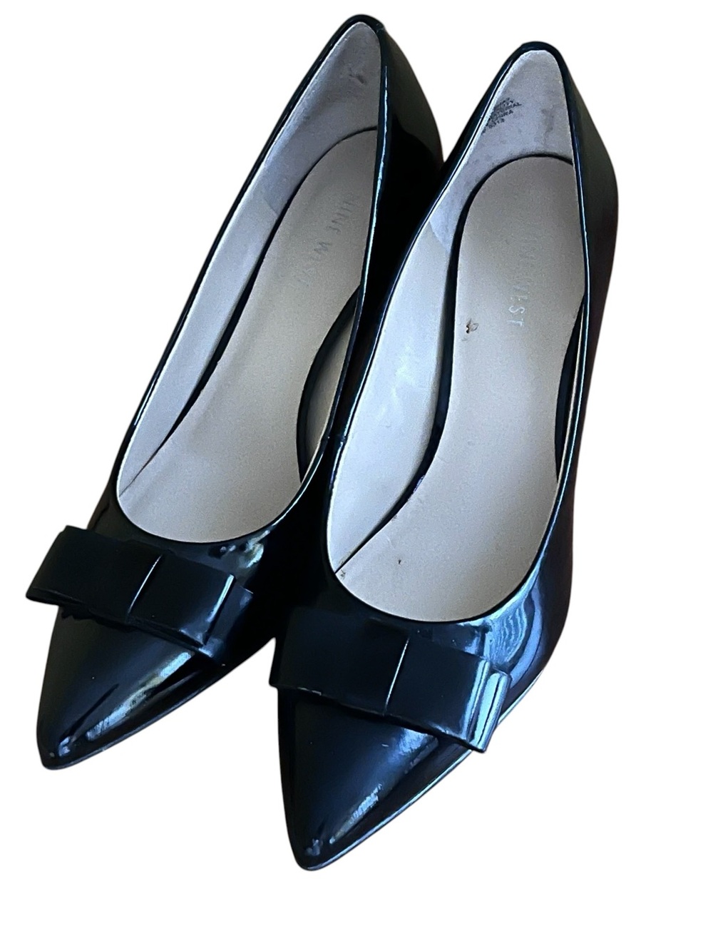 Nine West black pointed toe pumps with bow accent 
Size 7.5